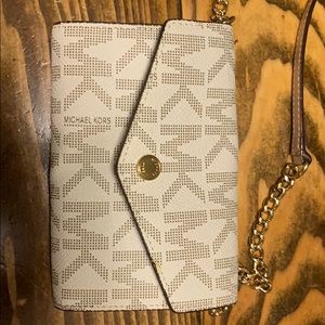 MICHAEL KORS wallet purse with side strap.